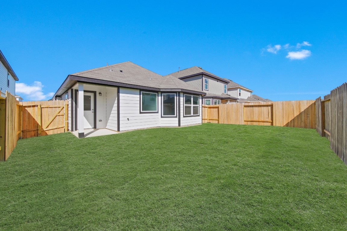 13655 Kit Run Splendora, TX 77372 - Photo 17 of 25 a front view of a house with a yard