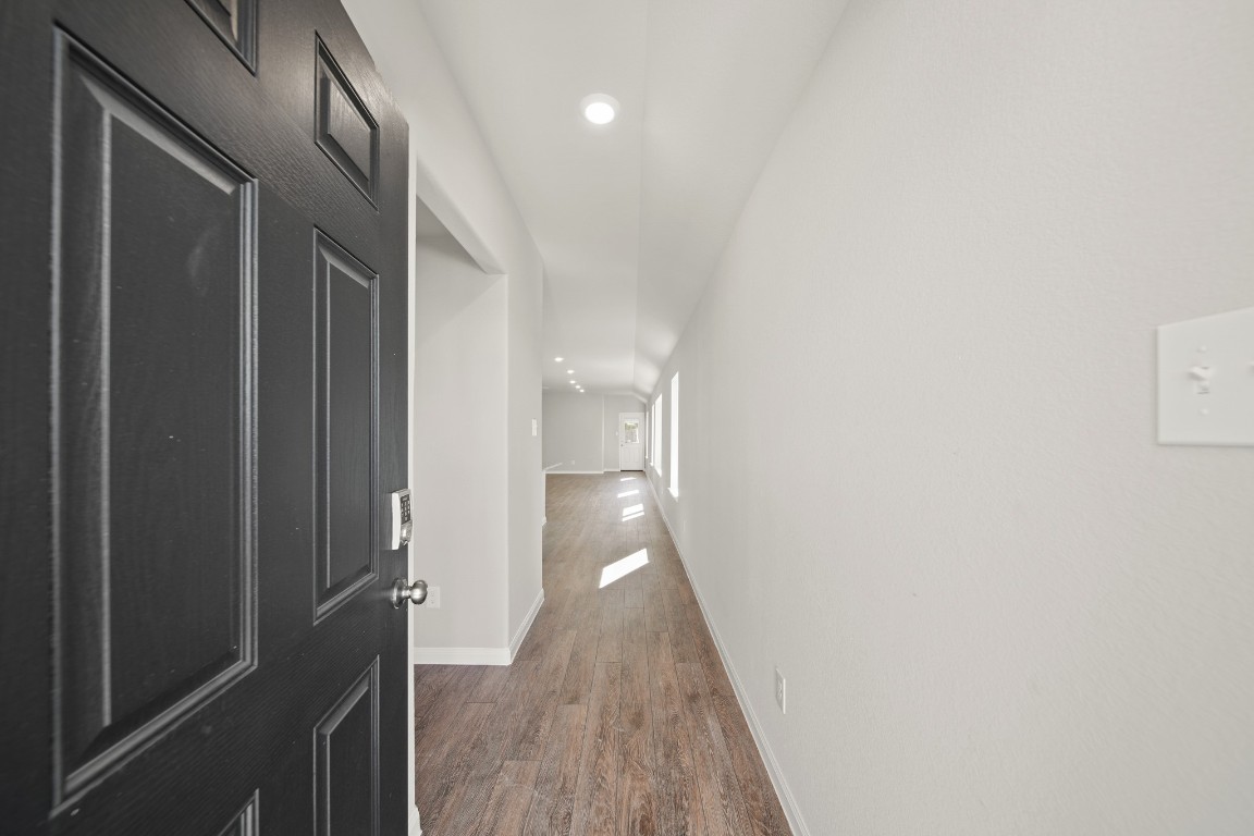 13655 Kit Run Splendora, TX 77372 - Photo 3 of 25 a view of a hallway with wooden floor