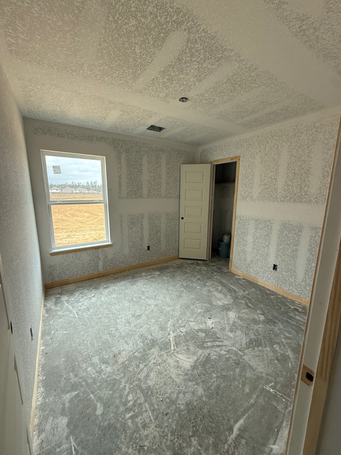 13655 Kit Run Splendora, TX 77372 - Photo 4 of 38 a view of an empty room and a window