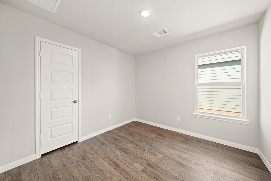 13655 Kit Run Splendora, TX 77372 - Photo 9 of 25 an empty room with wooden floor and window