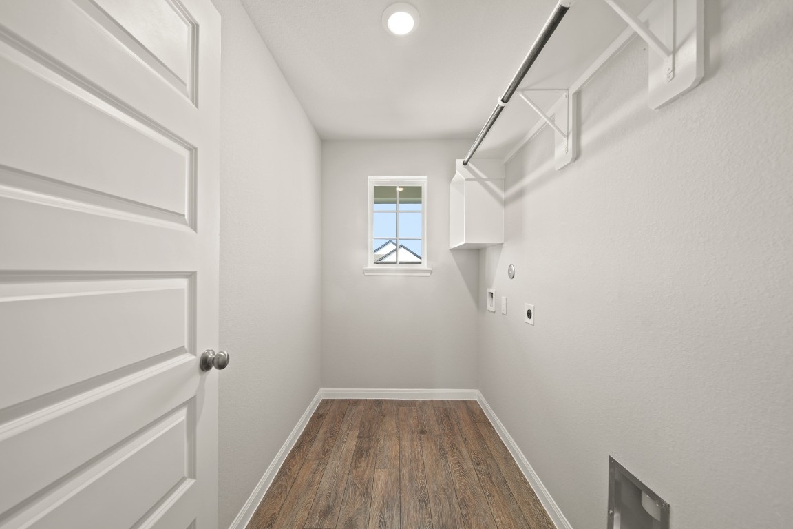 13655 Kit Run Splendora, TX 77372 - Photo 10 of 25 a view of hallway with stairs and wooden floor