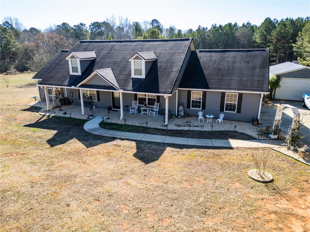 4221 Hester Town Road Social Circle, GA 30025 - Photo 1 of 1 an aerial view of a house with swimming pool
