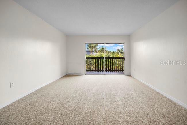 1695 Lee Road, Unit E204 Winter Park, FL 32789 - Photo 6 of 27 a view of an empty room with a windows