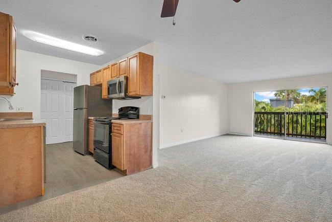 1695 Lee Road, Unit E204 Winter Park, FL 32789 - Photo 10 of 27 a view of a kitchen with furniture and a kitchen