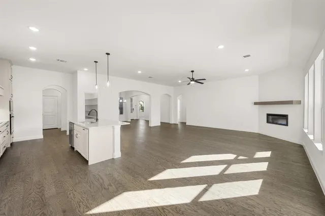 a view of kitchen with furniture and a fireplace