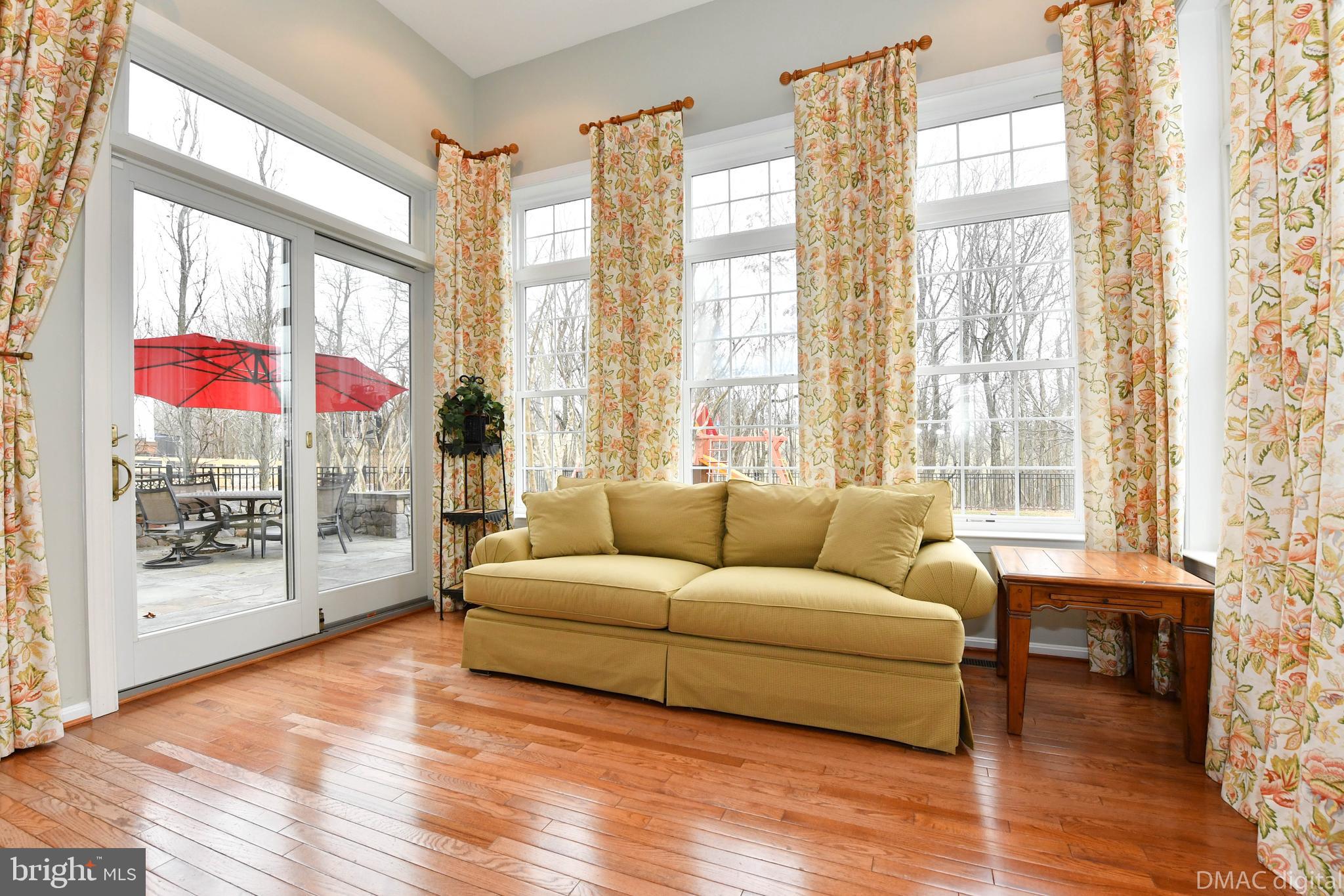 1604 Rising Ridge Road Mount Airy, MD 21771 - Photo 17 of 56 Step down sunroom leads to stone patio