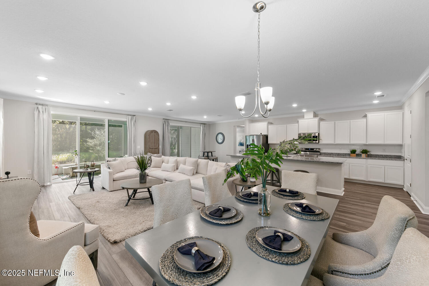 56310 Creekside Way Callahan, FL 32011 - Photo 14 of 47 a view of a dining room and furniture and chandelier