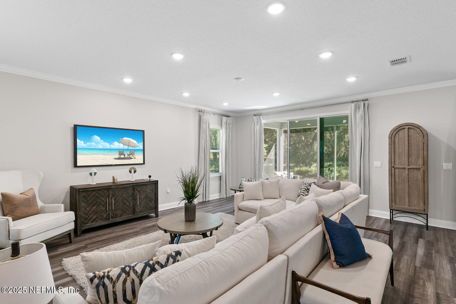 56310 Creekside Way Callahan, FL 32011 - Photo 15 of 47 a living room with furniture and a flat screen tv