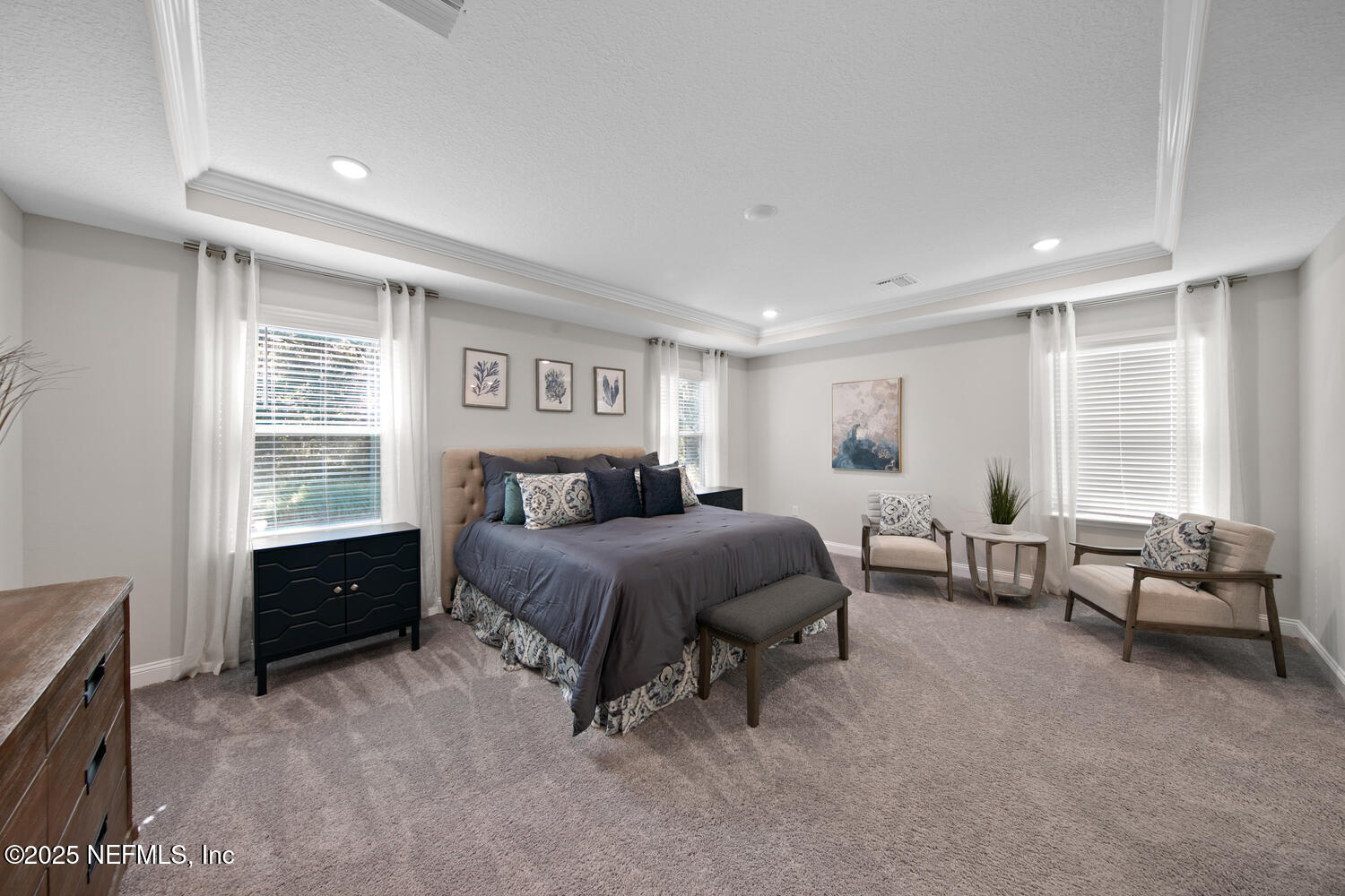56310 Creekside Way Callahan, FL 32011 - Photo 20 of 47 a spacious bedroom with a bed and a window