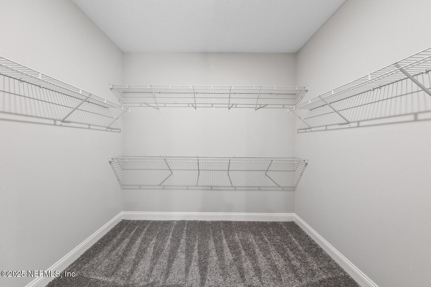 56310 Creekside Way Callahan, FL 32011 - Photo 25 of 47 a view of a room with racks on the wall