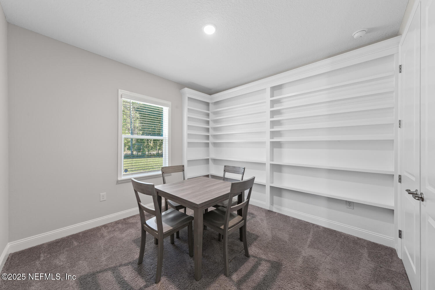 56310 Creekside Way Callahan, FL 32011 - Photo 29 of 47 a view of a dining room with a table and chairs