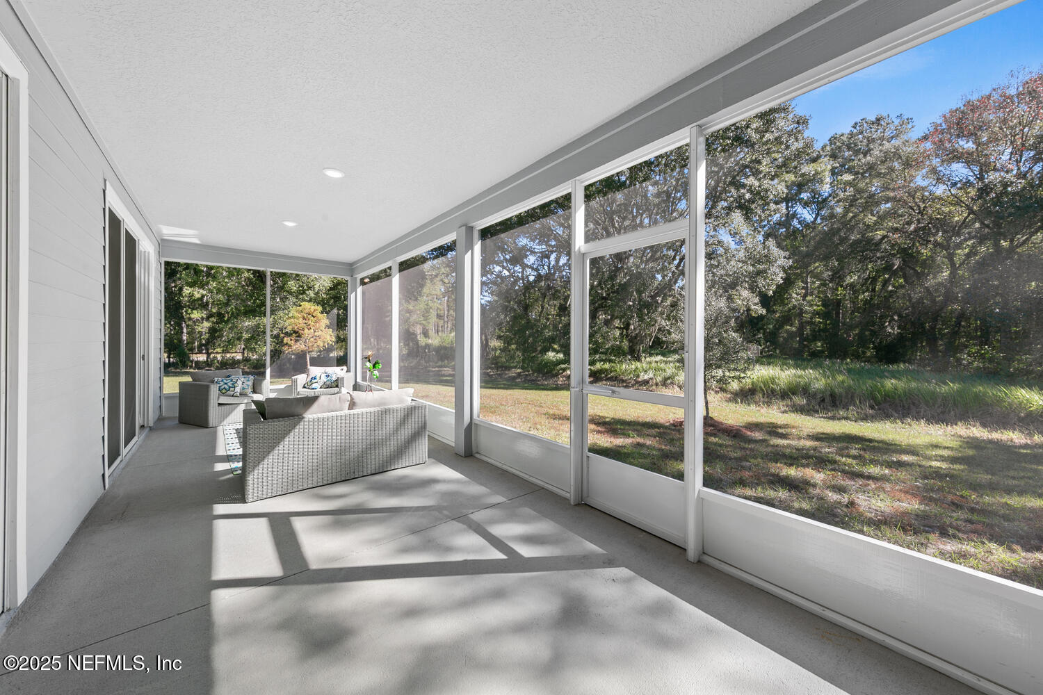56310 Creekside Way Callahan, FL 32011 - Photo 36 of 47 a living room with hardwood floor and a large window