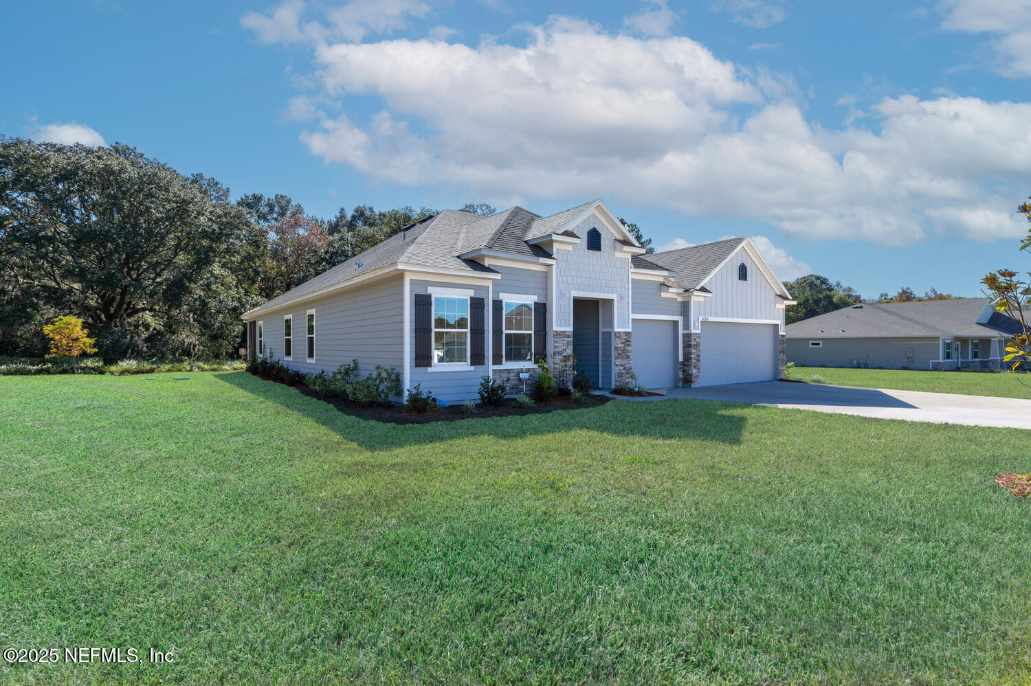 56310 Creekside Way Callahan, FL 32011 - Photo 41 of 47 a view of a house with backyard and garden