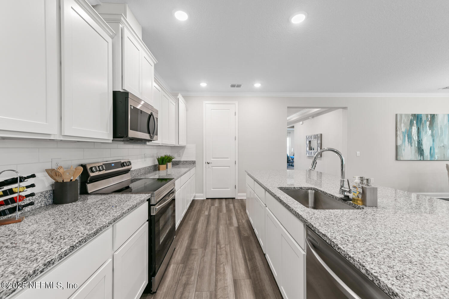 56310 Creekside Way Callahan, FL 32011 - Photo 8 of 47 a kitchen with sink stove top oven and microwave