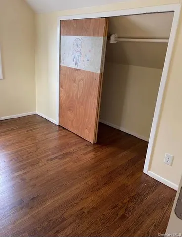 an entryway with wooden floor