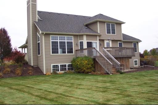 8311 Eagle Ridge Spring Grove, IL 60081 - Photo 2 of 16 a front view of a house with a yard