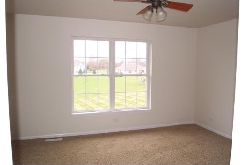 8311 Eagle Ridge Spring Grove, IL 60081 - Photo 14 of 16 a view of an empty room with a window