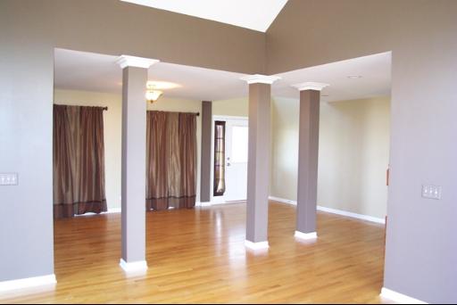 8311 Eagle Ridge Spring Grove, IL 60081 - Photo 4 of 16 a view of a hallway with wooden floor