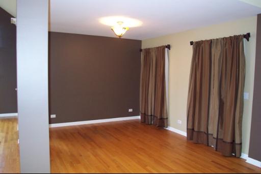 8311 Eagle Ridge Spring Grove, IL 60081 - Photo 5 of 16 an empty room with wooden floor and windows
