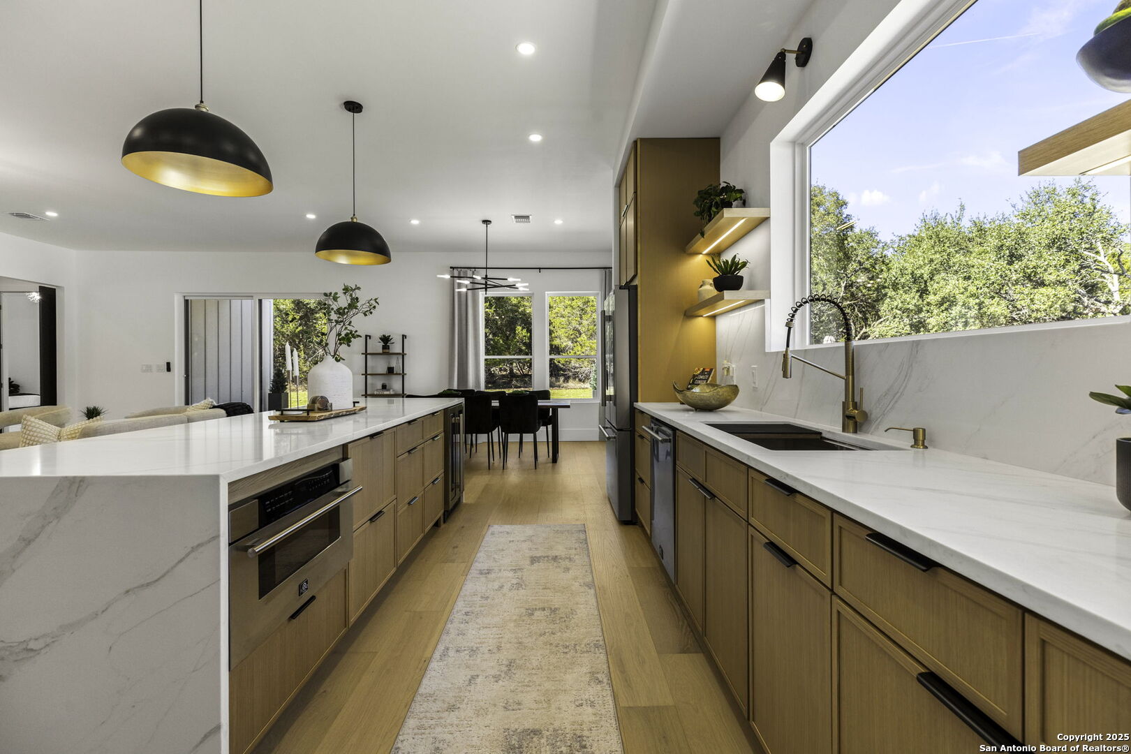 120 River View Boerne, TX 78006 - Photo 13 of 42 a large kitchen with stainless steel appliances kitchen island a large counter top