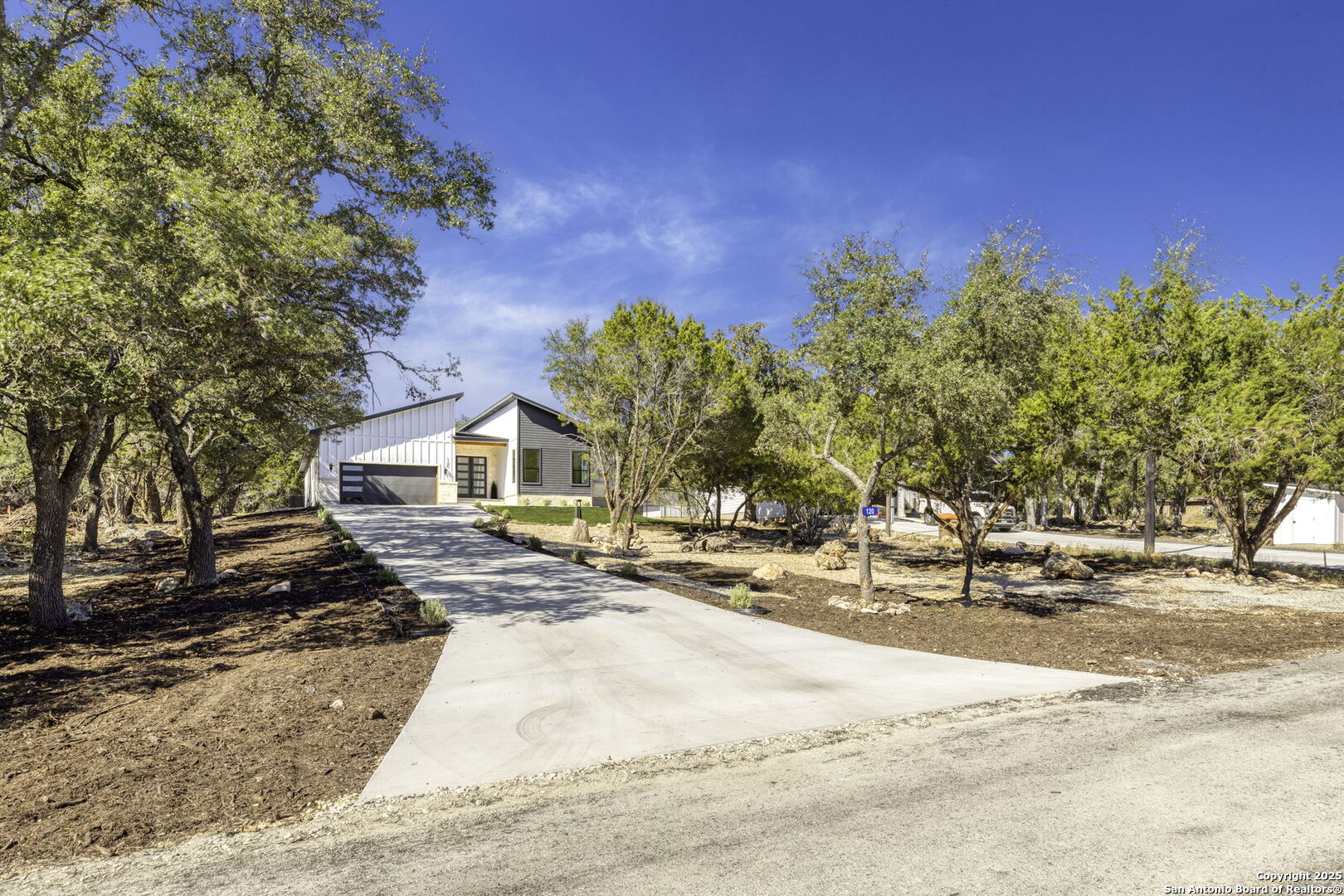 120 River View Boerne, TX 78006 - Photo 2 of 42 a view of a house with a snow on the road