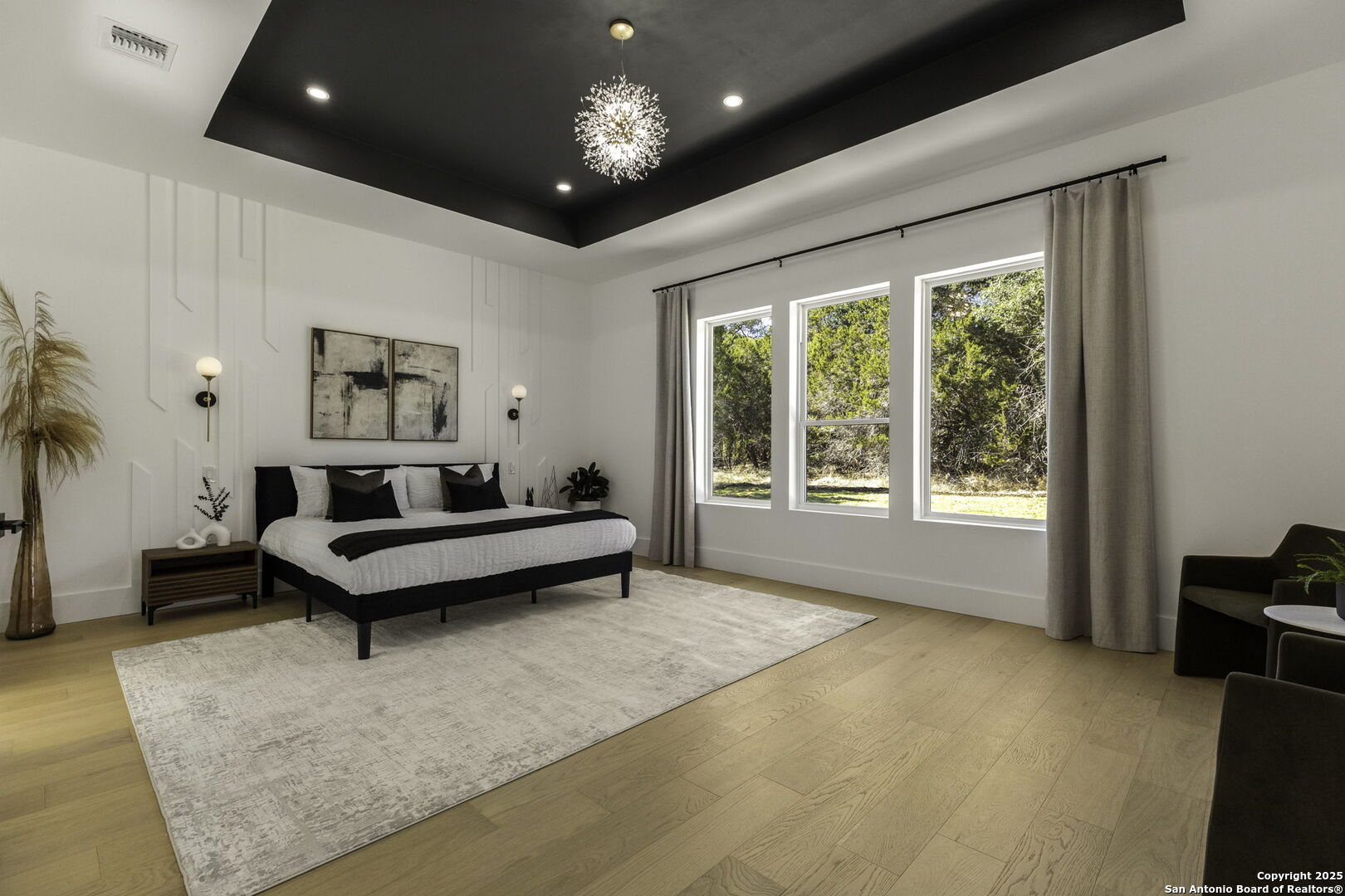 120 River View Boerne, TX 78006 - Photo 25 of 42 a spacious bedroom with a bed and a couch