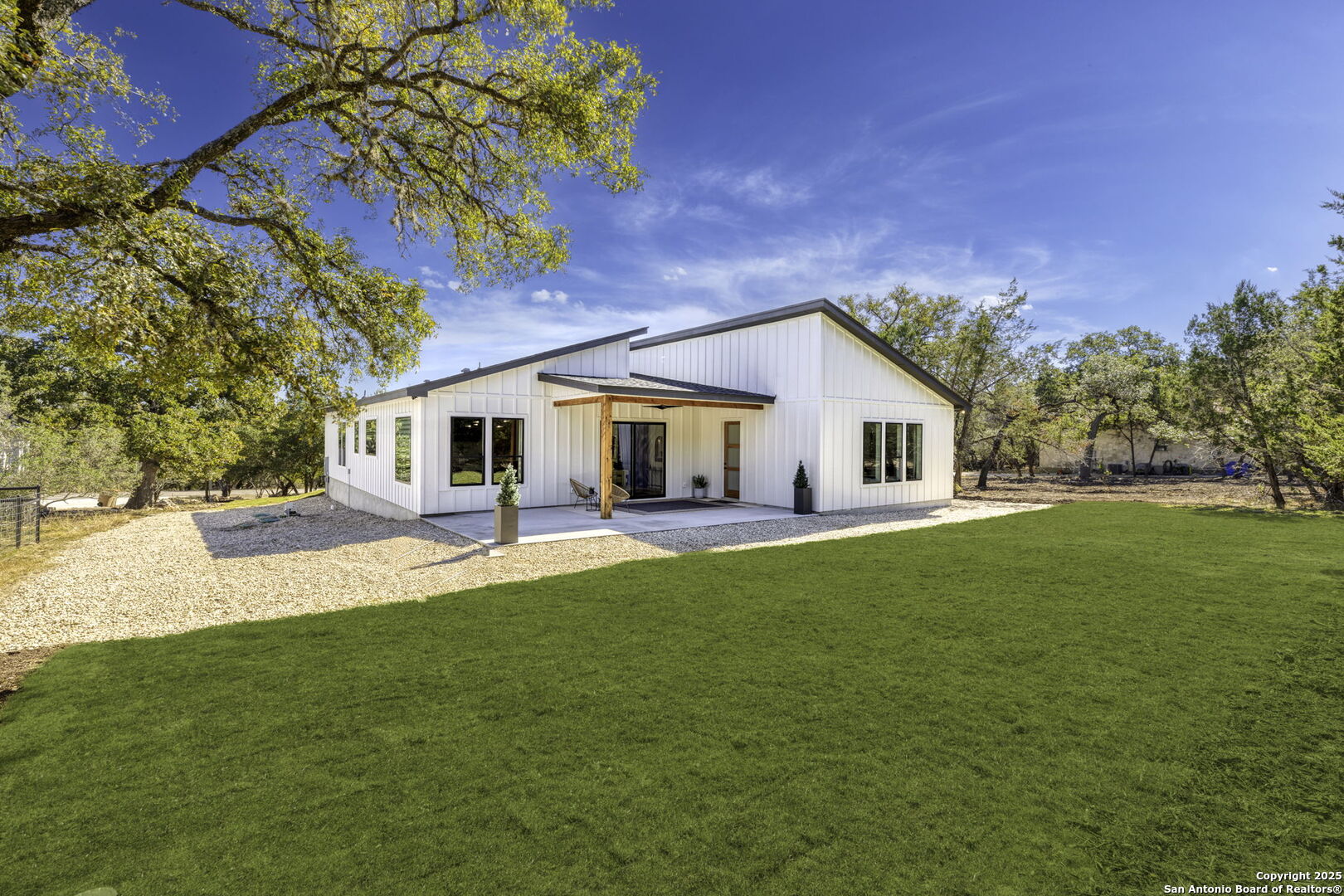 120 River View Boerne, TX 78006 - Photo 33 of 42 a front view of a house with a garden and yard
