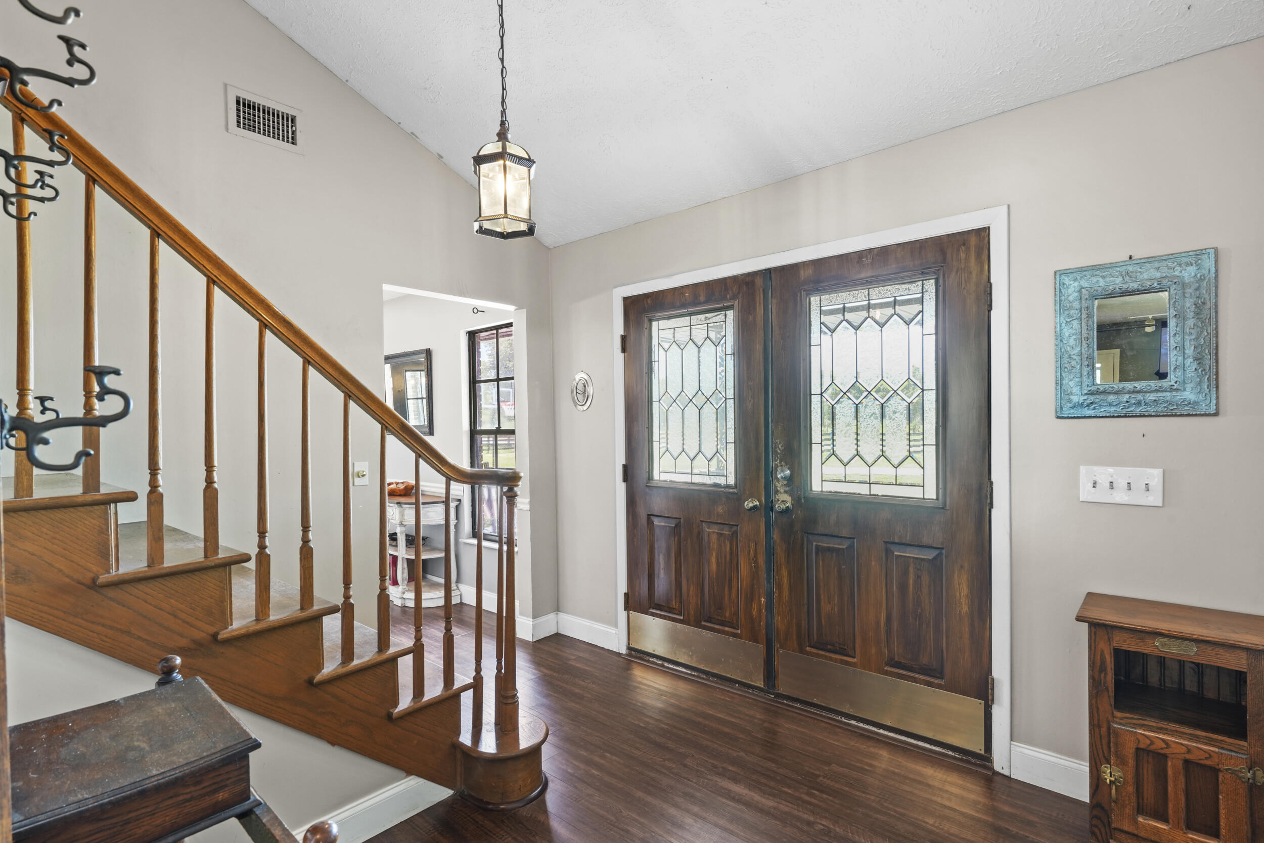 4170 McCarty Road Fort Pierce, FL 34945 - Photo 10 of 57 a view of entryway with wooden floor and stair