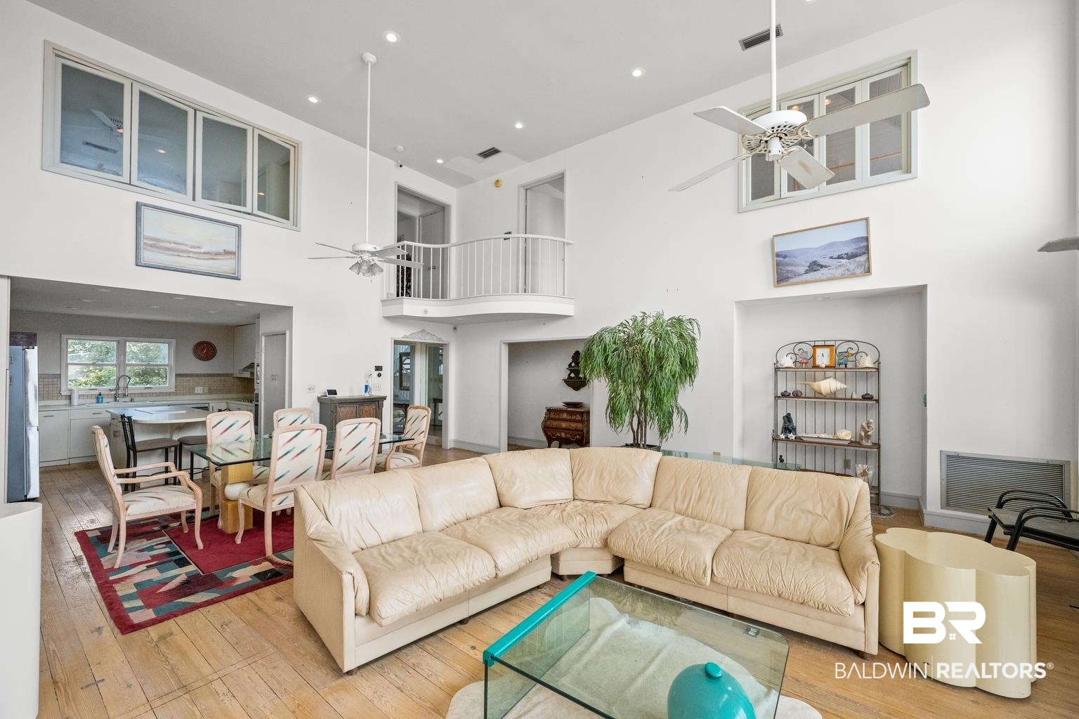 29255 Ono Boulevard Orange Beach, AL 36561 - Photo 21 of 43 Living area featuring ceiling fan, hardwood / wood-style floors, a towering ceiling, and recessed lighting