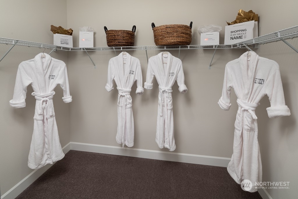2835 Arrowroot Street Southeast Lacey, WA 98513 - Photo 8 of 19 a view of walk in closet with clothes and shoes
