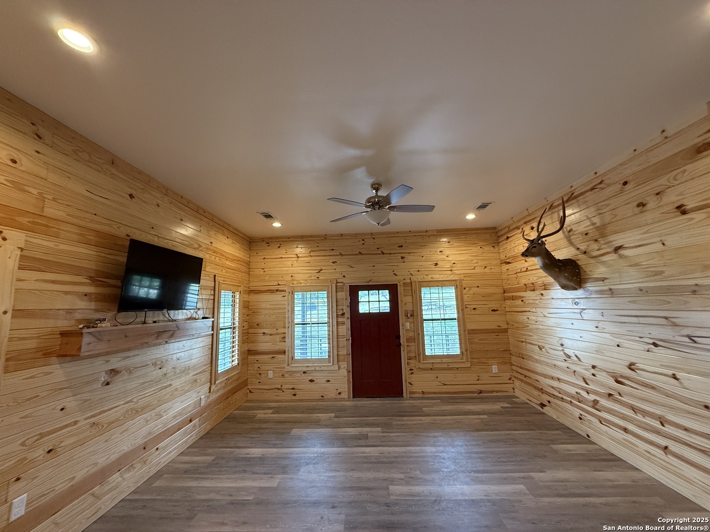 1540 Rough Rider Road Junction, TX 76874 - Photo 2 of 31 a view of a livingroom with wooden floor