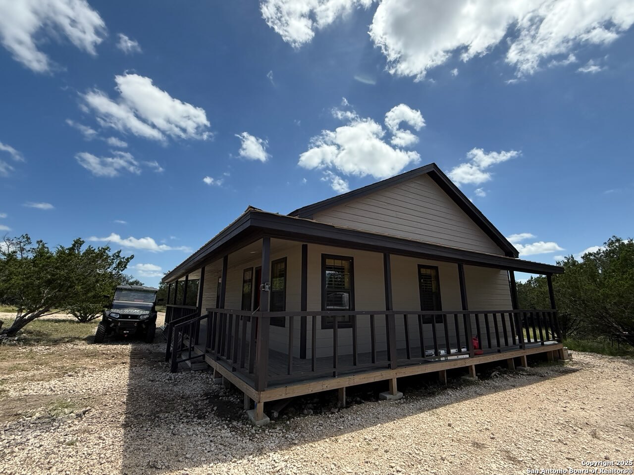 1540 Rough Rider Road Junction, TX 76874 - Photo 31 of 31 a view of a small yard with wooden fence and a barbeque