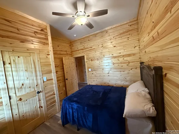 a bedroom with a bed and a walk in closet