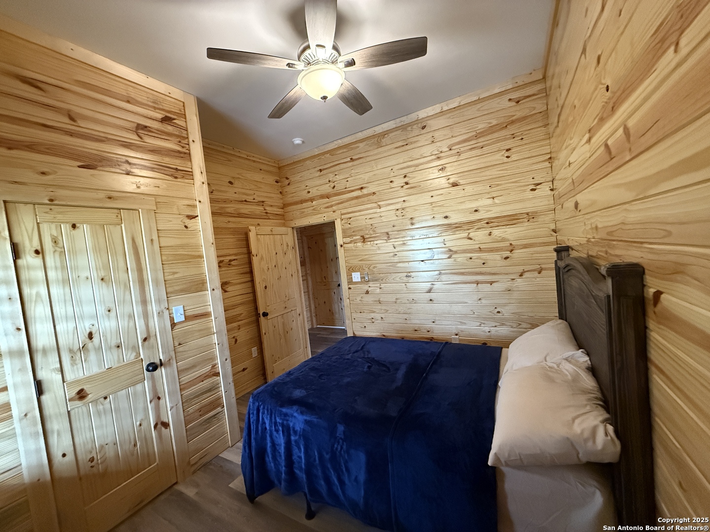 1540 Rough Rider Road Junction, TX 76874 - Photo 10 of 31 a bedroom with a bed and a walk in closet