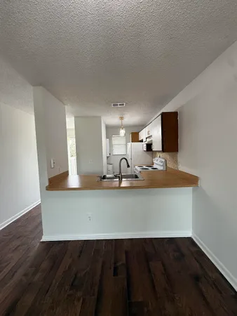 a view of kitchen island with wooden floor