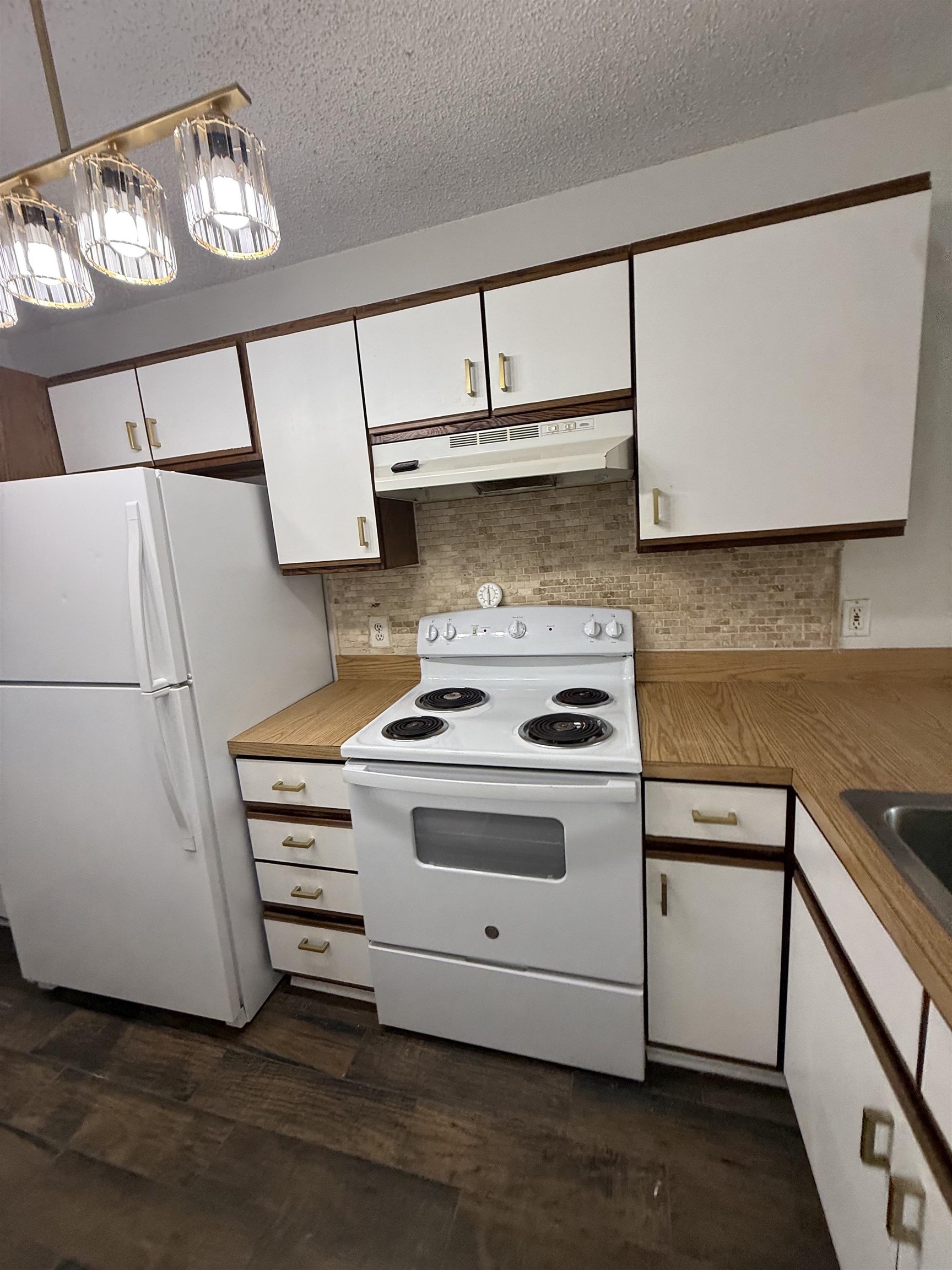 650 West Pope Road, Unit 206 St. Augustine, FL 32080 - Photo 6 of 10 a white stove top oven sitting inside of a kitchen