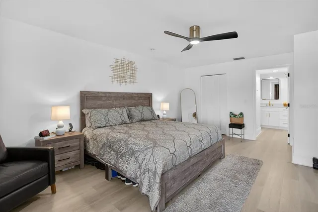 a bedroom with bed and window