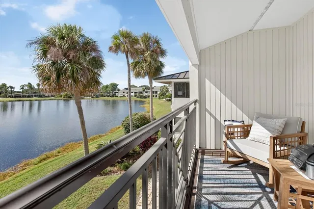 a view of a balcony with chairs