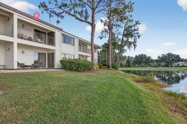 a view of residential houses with lake and lake view
