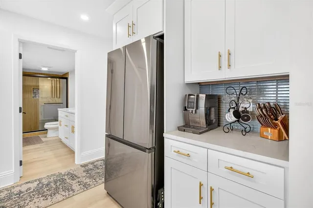 a view of a refrigerator and mirror