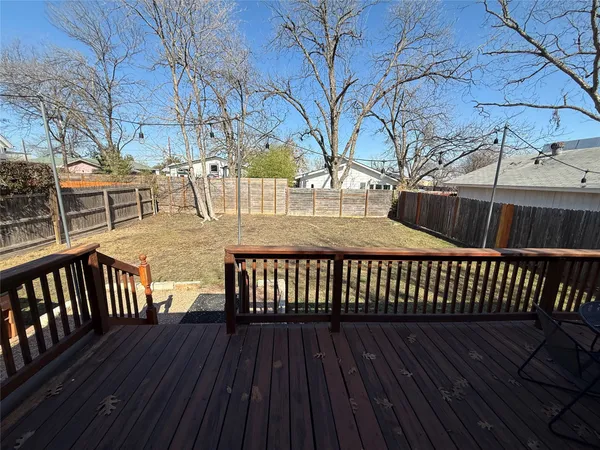 a view of balcony with wooden floor