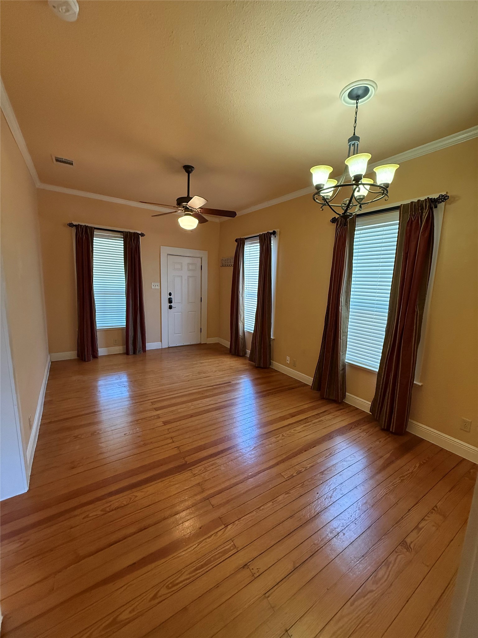 406 Normandy Street Austin, TX 78704 - Photo 5 of 13 a view of a hallway with wooden floor and stairs
