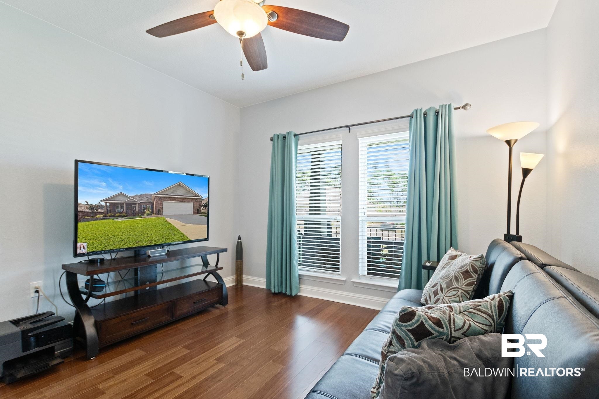 31541 Hoot Owl Road Daphne, AL 36527 - Photo 32 of 51 Living room with wood-type flooring and ceiling fan