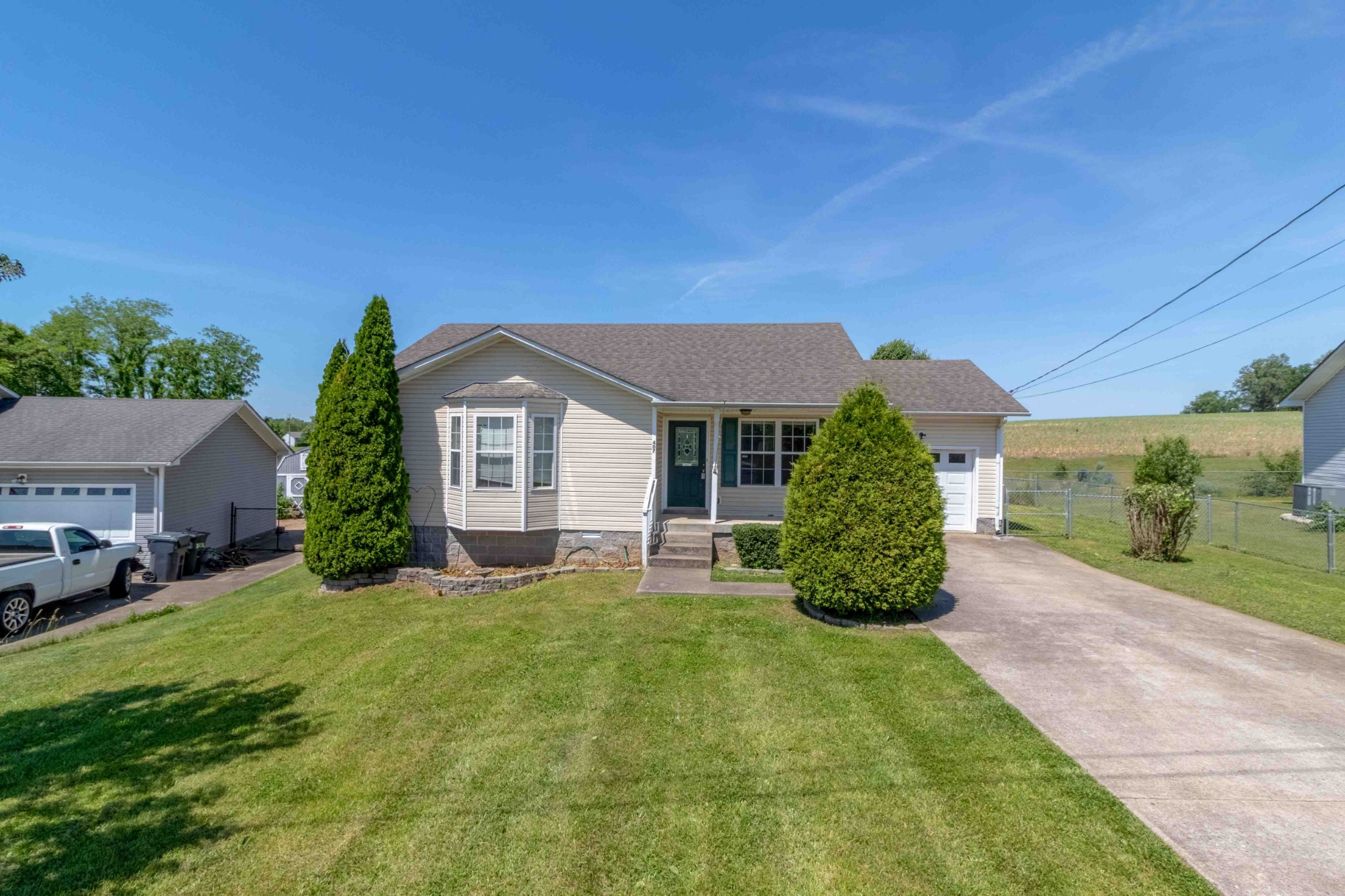 407 Filmore Road Oak Grove, KY 42262 - Photo 2 of 25 a view of a house with a yard and plants