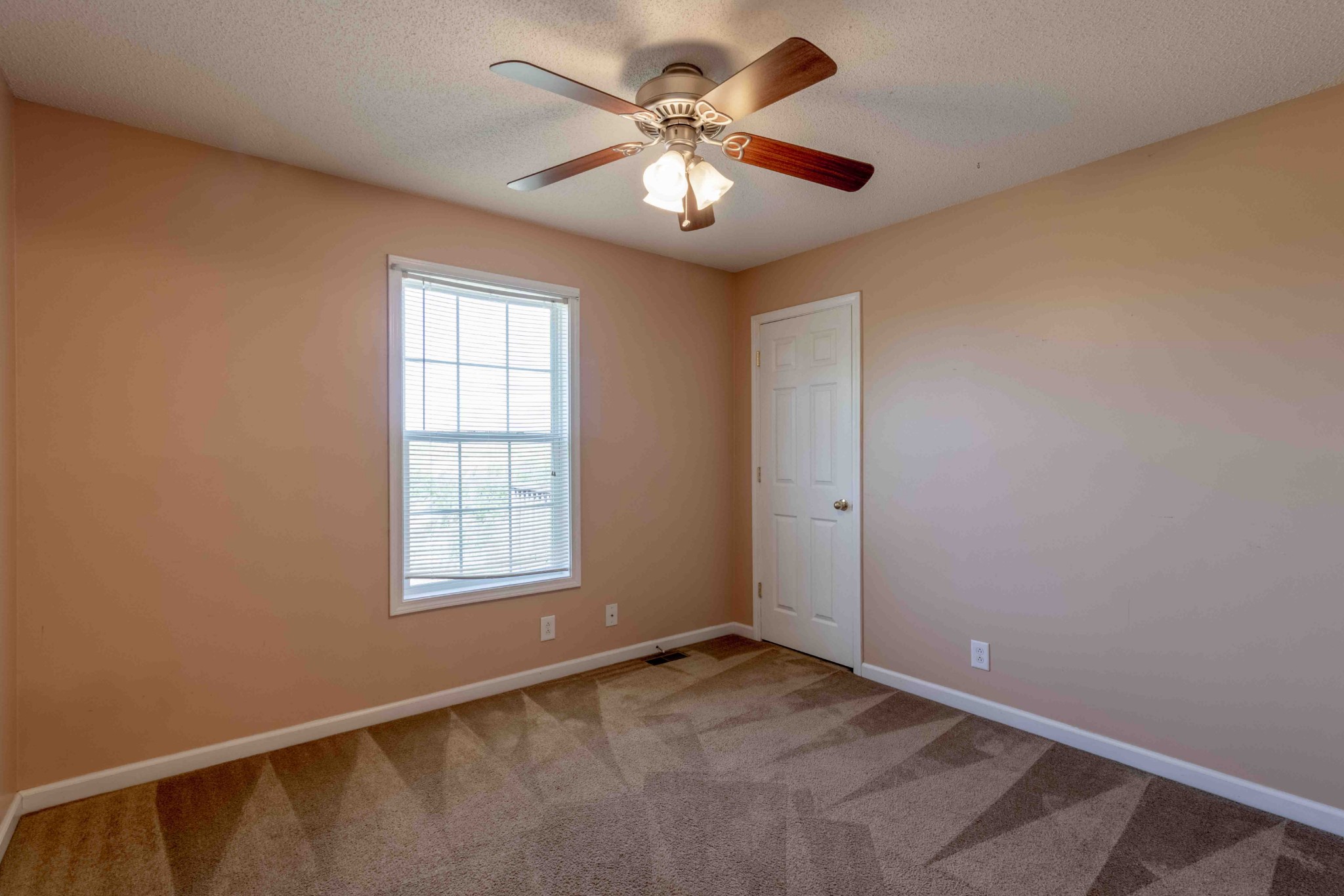 407 Filmore Road Oak Grove, KY 42262 - Photo 18 of 25 a view of a livingroom with a ceiling fan and window