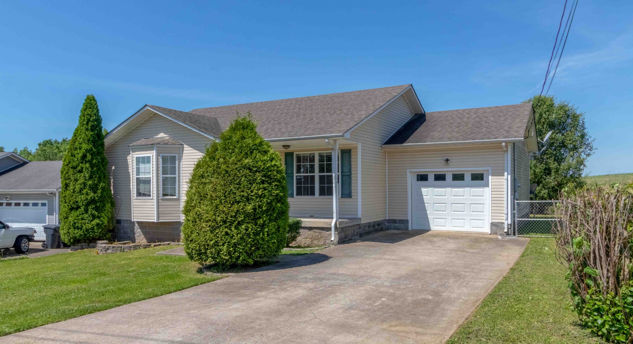 407 Filmore Road Oak Grove, KY 42262 - Photo 3 of 25 a front view of a house with a garden and plants