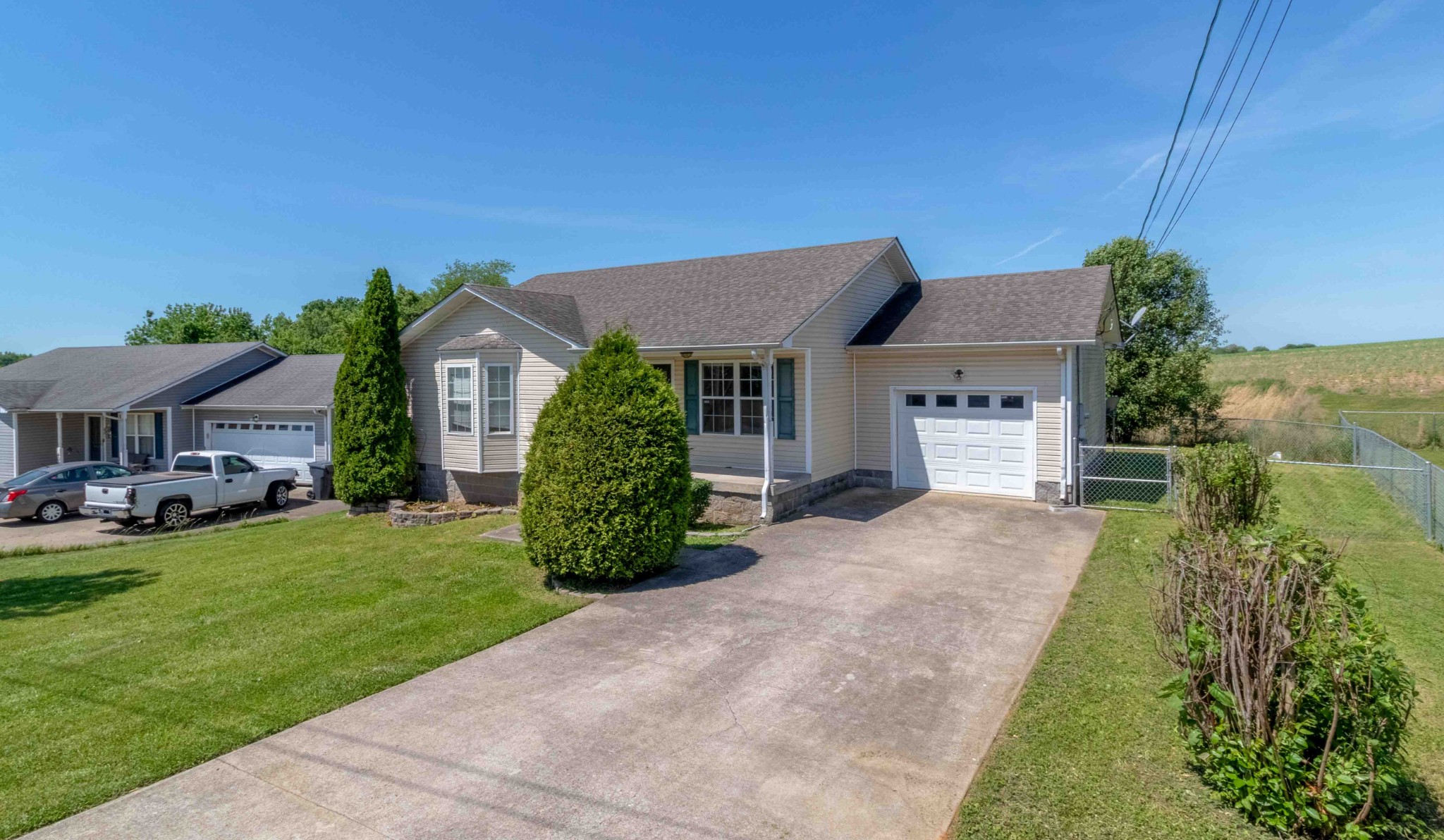 407 Filmore Road Oak Grove, KY 42262 - Photo 4 of 25 a front view of a house with a garden and yard