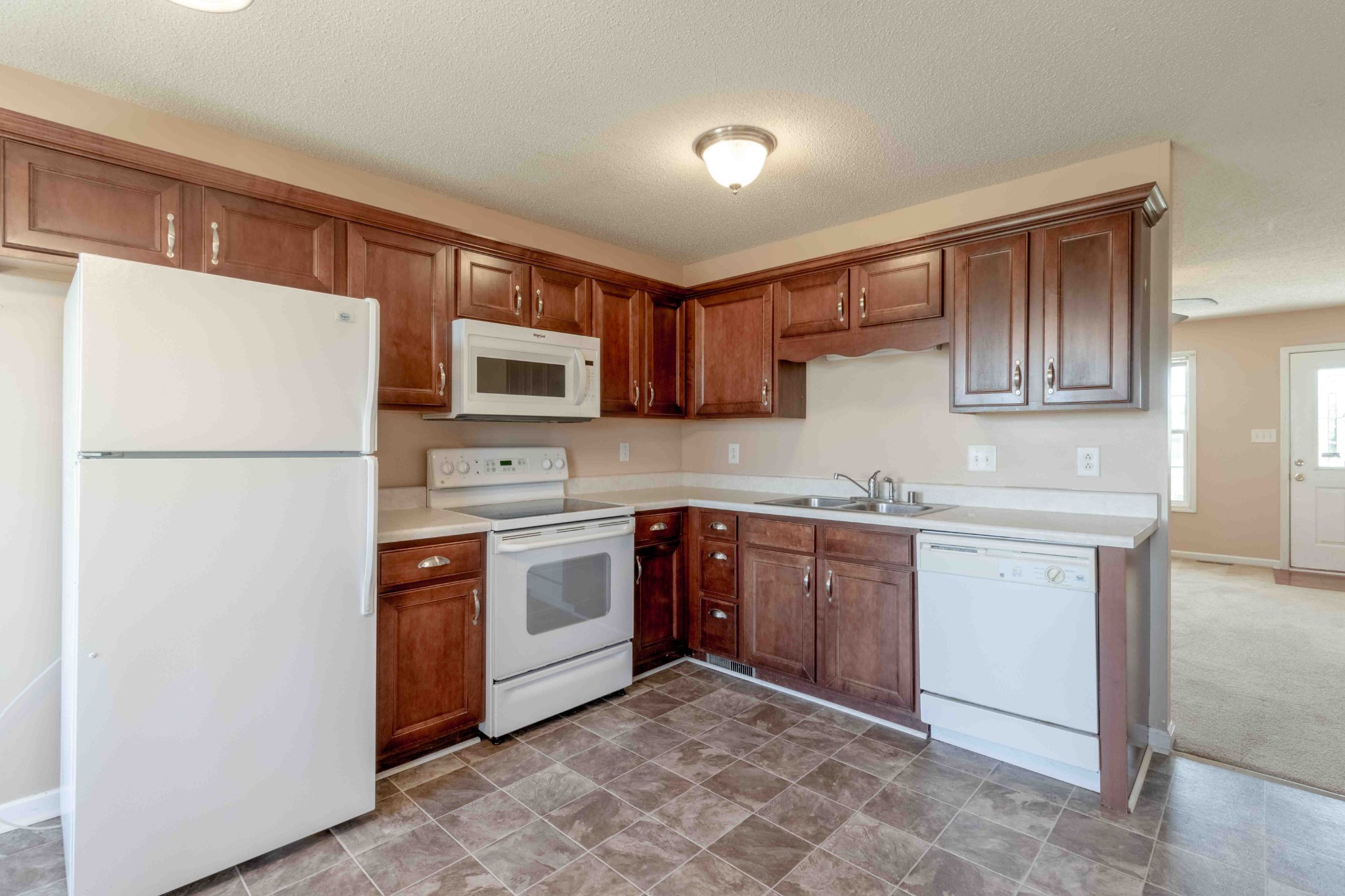 407 Filmore Road Oak Grove, KY 42262 - Photo 10 of 25 a kitchen with stainless steel appliances granite countertop a refrigerator sink and stove