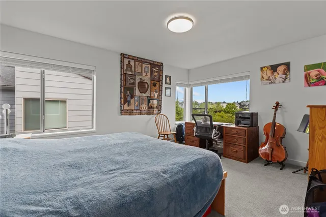 a bed room with furniture and a window