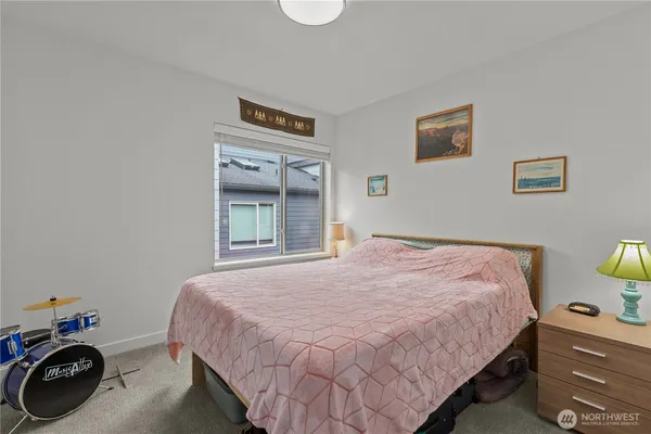 a bedroom with a bed and cabinets